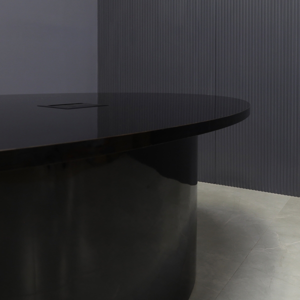 90-inch Newton Oval Conference Table With Laminate Top & base in black gloss laminate, and black MX3 powerbox.