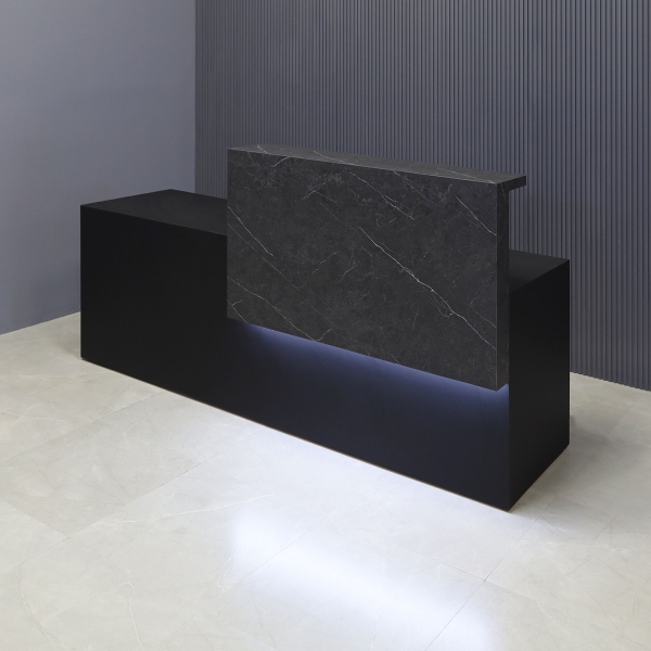 90-inch Los Angeles Custom Reception Desk with the counter on the right side when facing front in black stone PVC, and black traceless laminate desk, with white LED, shown here.