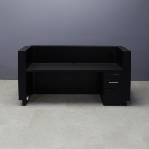 90-inch Nola Custom Reception Desk in black traceless laminate main desk, and brushed aluminum toe-kick. Built-in storage on the right side when sitting.