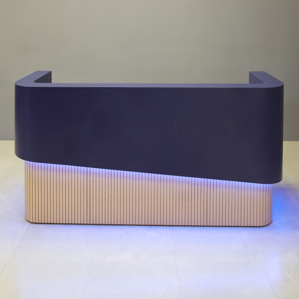 90-inch Nola Curved Custom Reception Desk in navy blue matte laminate counter & inside desk, white oak tambour front desk, and color changing LED.