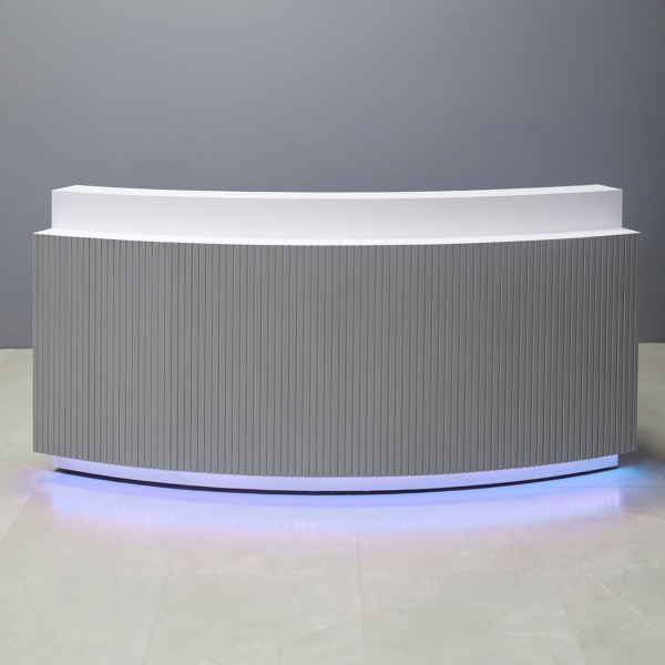 90-inch Seattle X3 Custom Reception Desk in white matte laminate main desk, fog gray tambour front panel, and color changing LED.