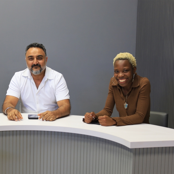 90-inch Modern Custom Podcast Table in white matte laminate top, fog gray tambour front side, and white matte laminate inside.