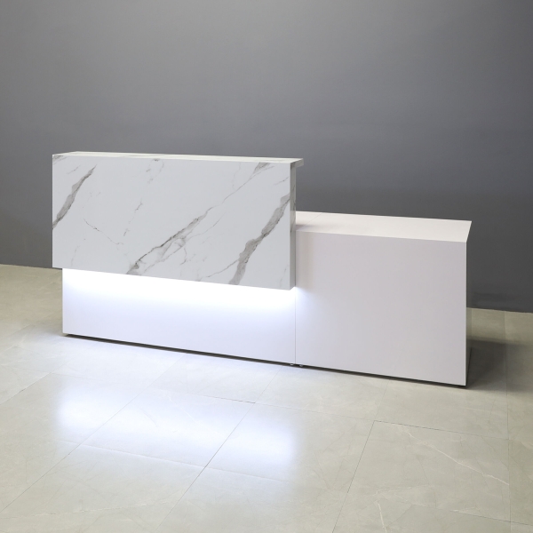 96-inch Los Angeles Long and ADA Compliant Custom Reception Desk with the counter on the left side when facing front in calcutta stone PVC, white gloss laminate desk, and warm white LED.