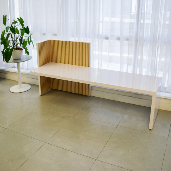 72-inch aXis Bench in white gloss laminate base, and maple tambour wall.