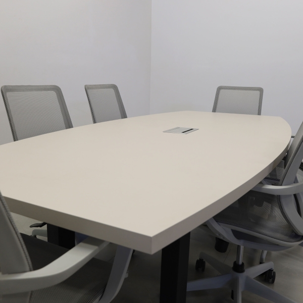92-inch Newton Boat Shaped Conference Table in beige traceless laminate top, black metal u-legs powder coated, and silver MX3 power box.